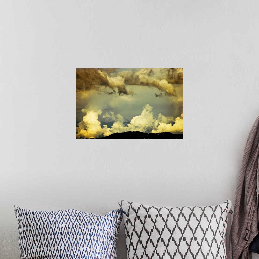 A bohemian room featuring Scattered monsoon clouds above hills