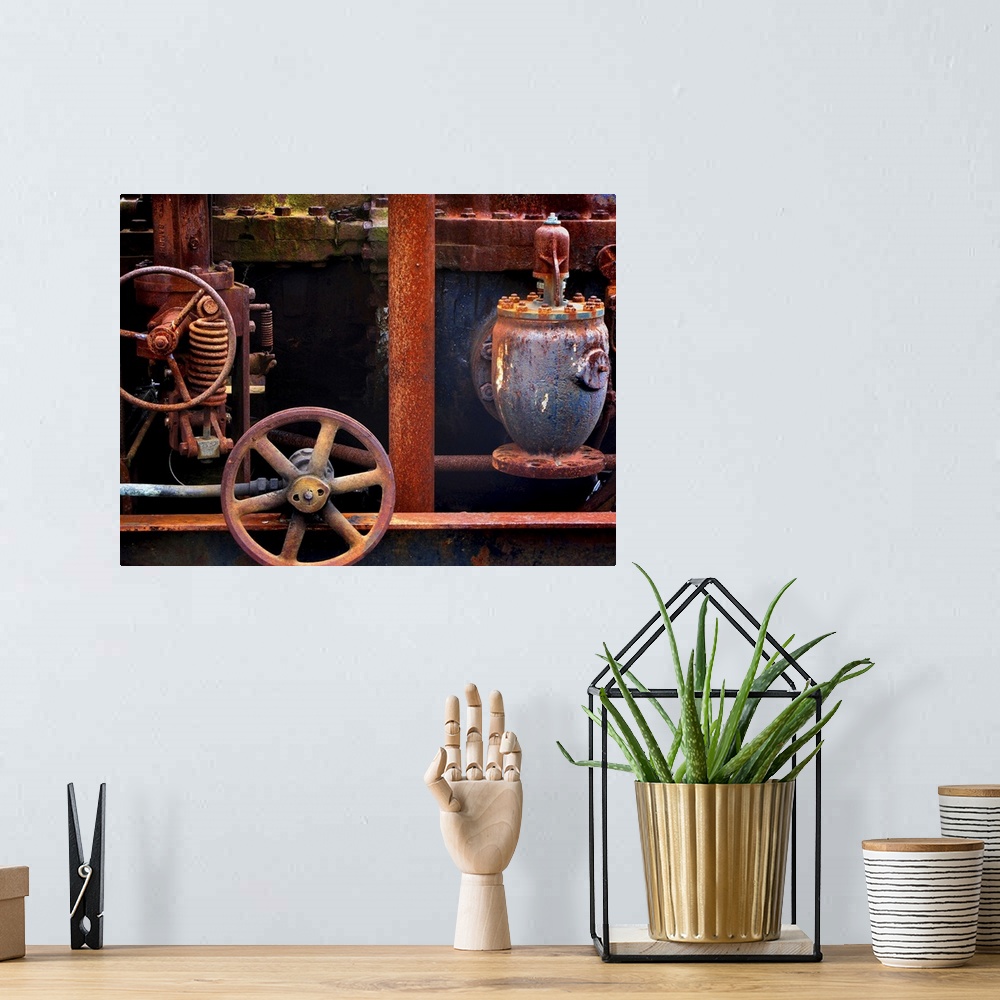 A bohemian room featuring Rustly old motor parts