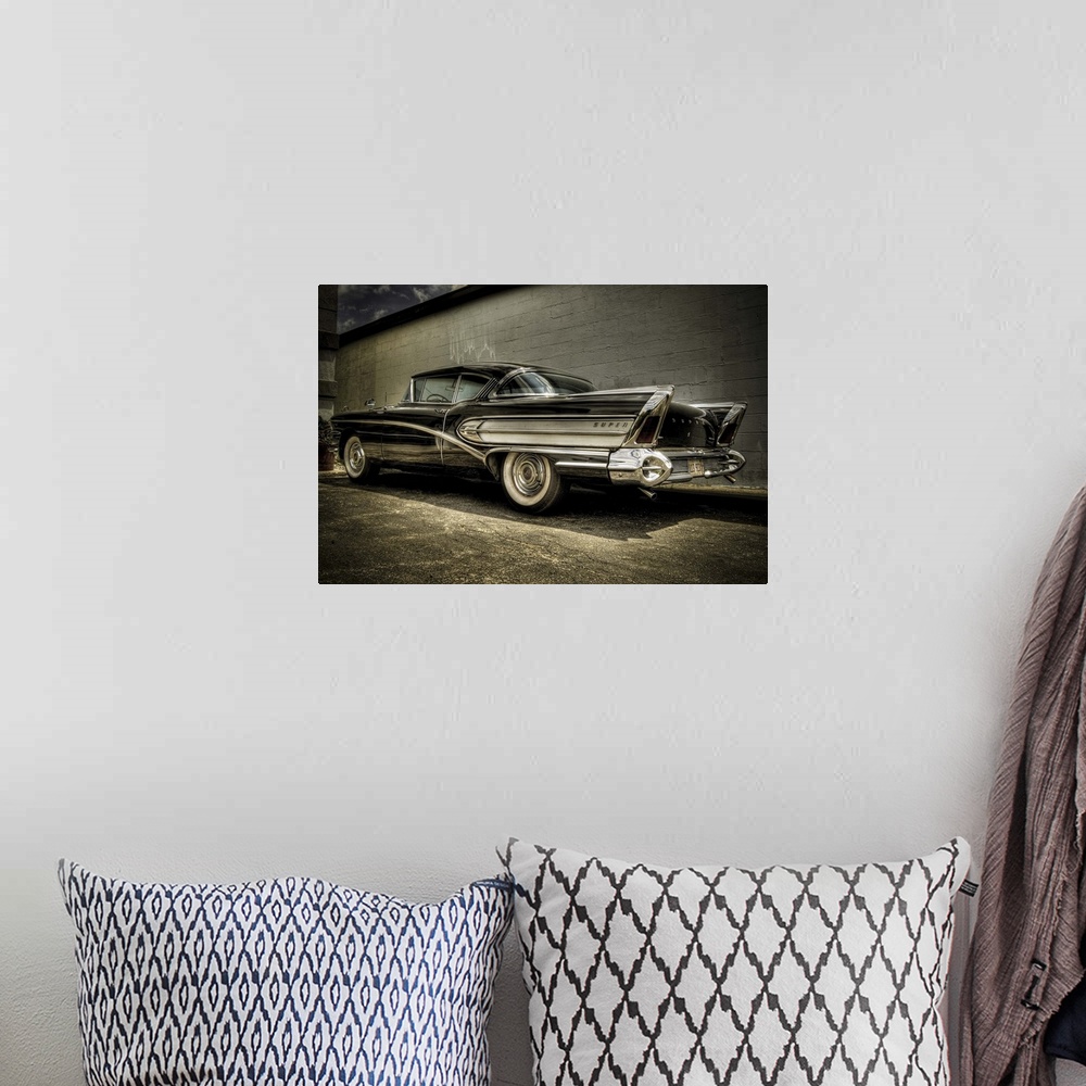 A bohemian room featuring vintage Buick Riviera