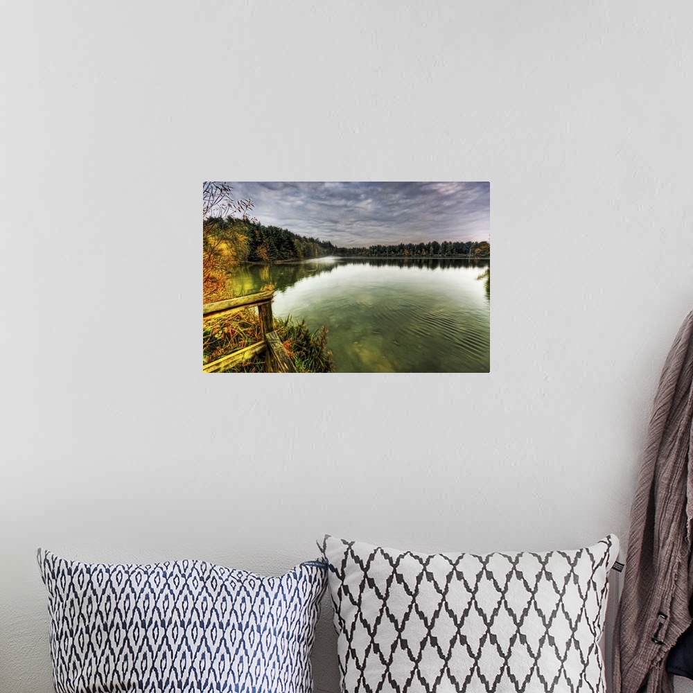 A bohemian room featuring View from a jetty across a misty foggy smooth boating lake with stormy dramatic skies and surroou...