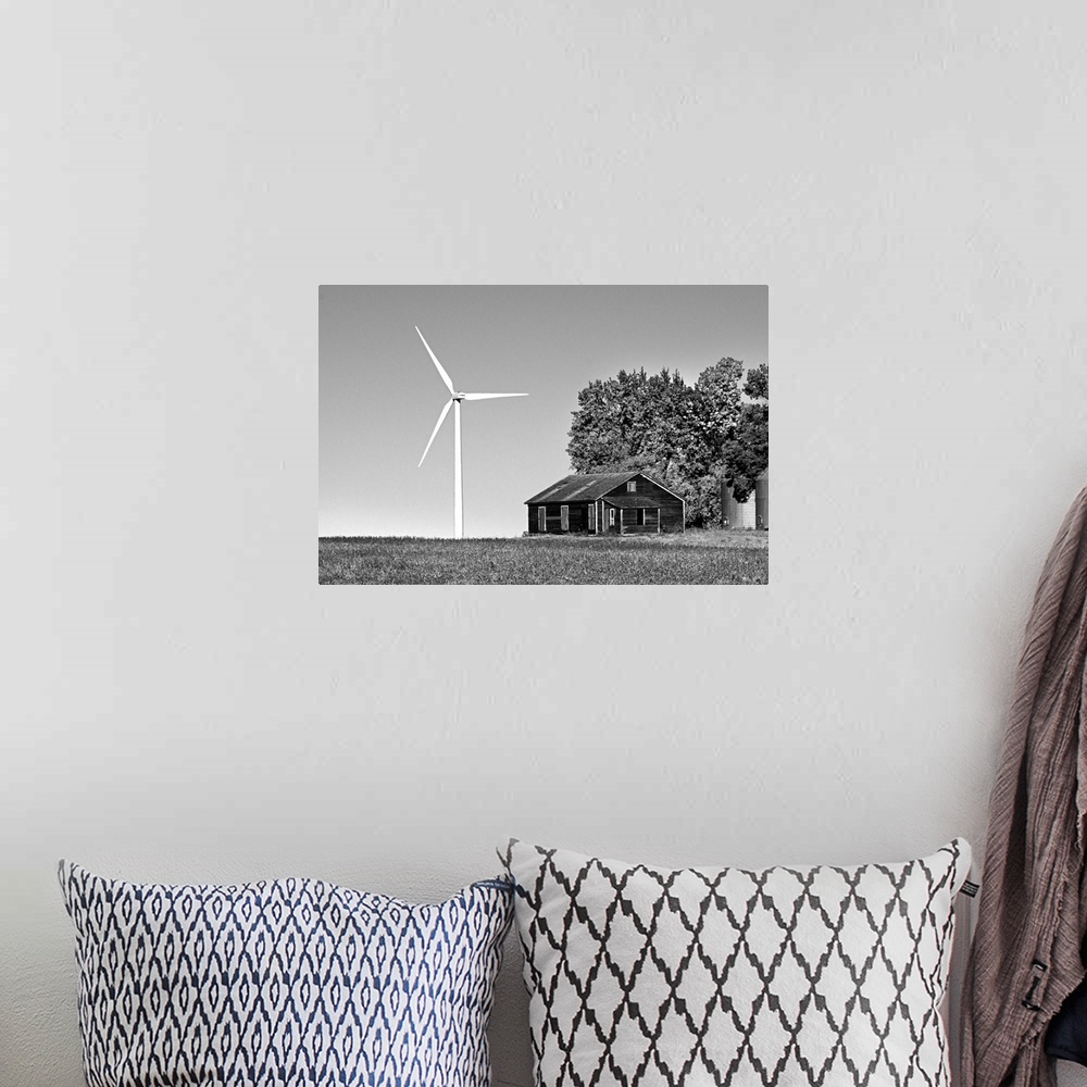 A bohemian room featuring Wind turbine in rural location with old barn in Cavalier County USA