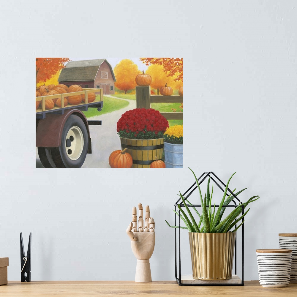 A bohemian room featuring Decorative Fall painting of a farm with a trailer full of pumpkins, potted mums, and a red barn i...