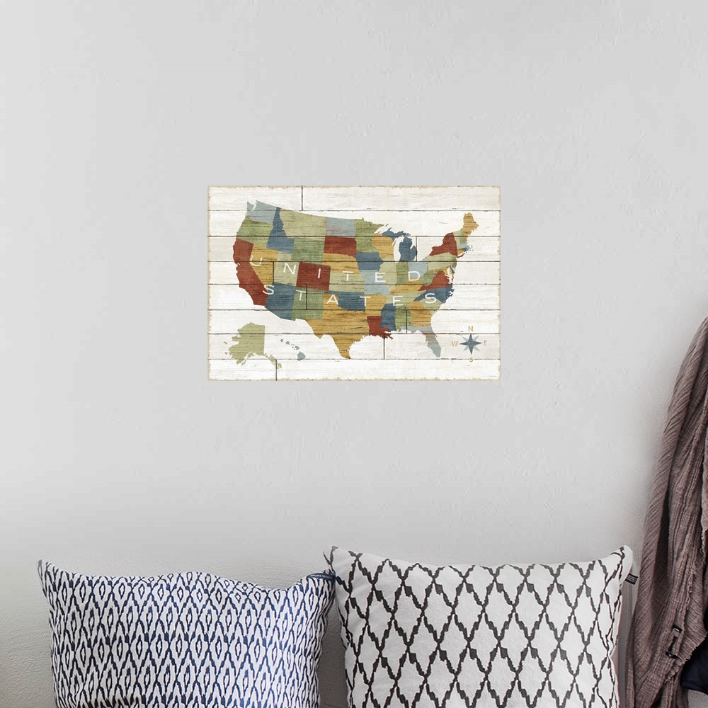 A bohemian room featuring Map of the United States with each state in different colors, on a wooden board background.