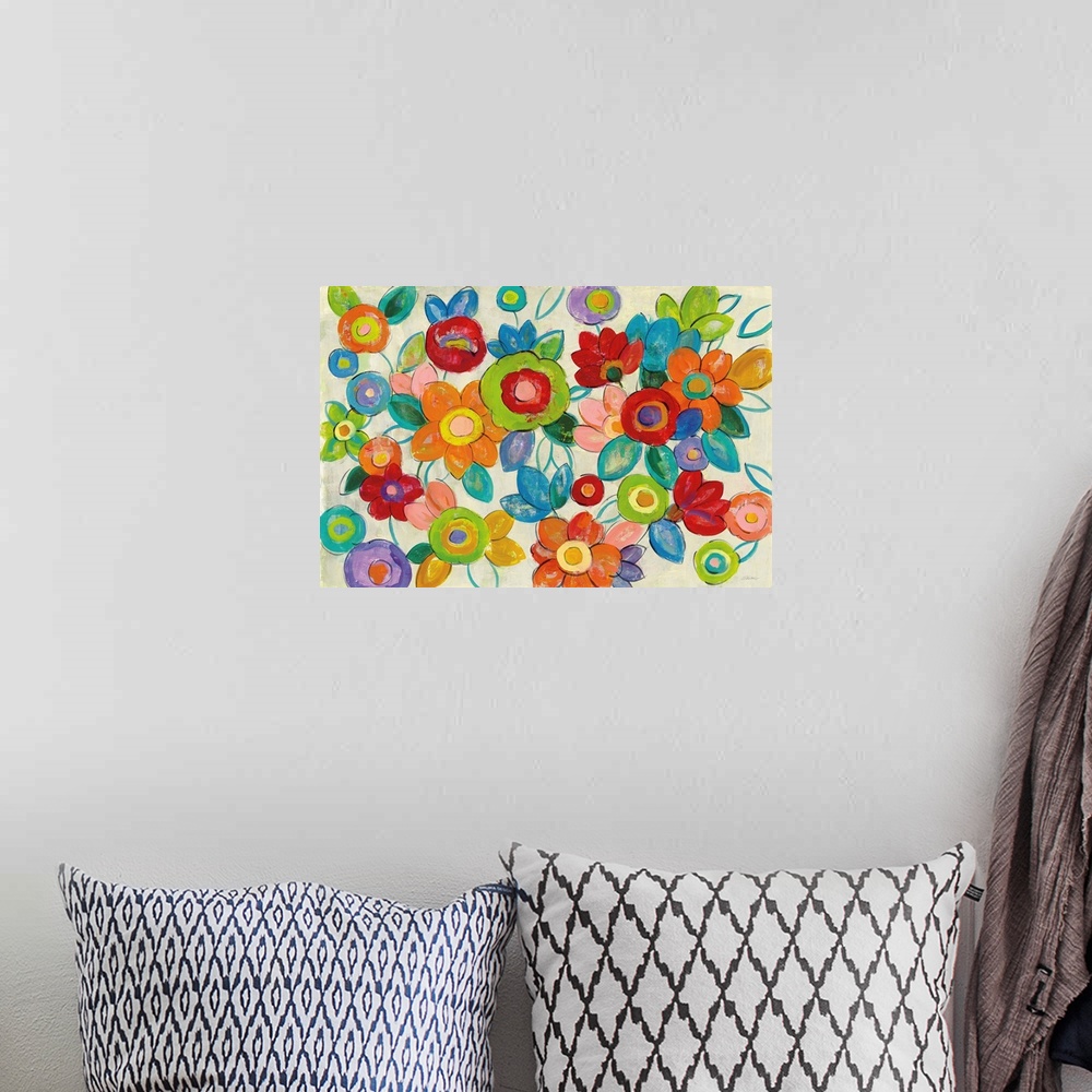 A bohemian room featuring Large abstract painting of bright flowers on a neutral background.