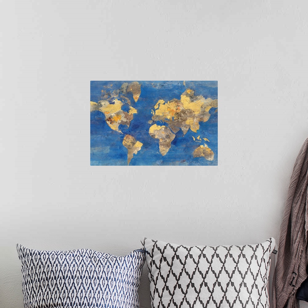 A bohemian room featuring A map of the world in golden tones with a deep blue ocean.