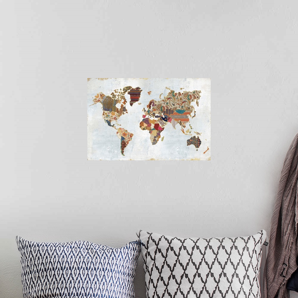 A bohemian room featuring Contemporary artwork of a world map made from different patterns.