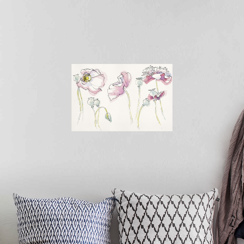 A bohemian room featuring Watercolor painting of soft pink flowers in different positions against a neutral toned background.