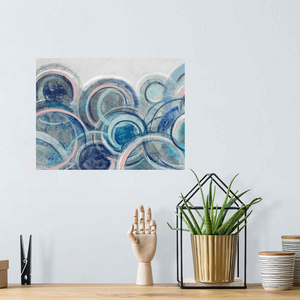 A bohemian room featuring Contemporary abstract artwork featuring an array of blue circles over a light gray background.