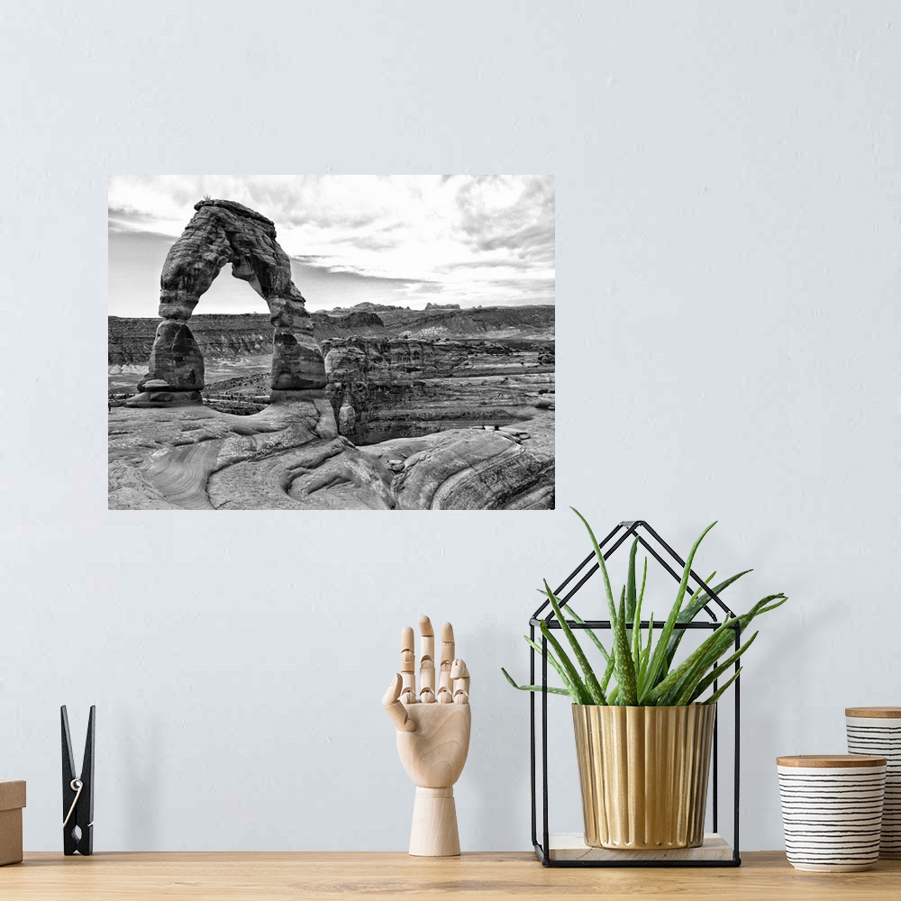 A bohemian room featuring Black and white photograph of Arches National Park.