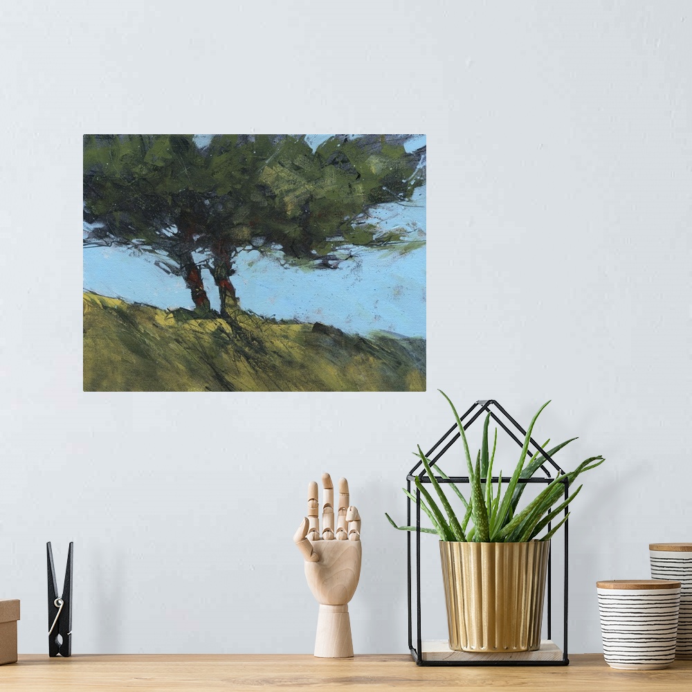 A bohemian room featuring Contemporary painting of twin trees next to each other on a hill.