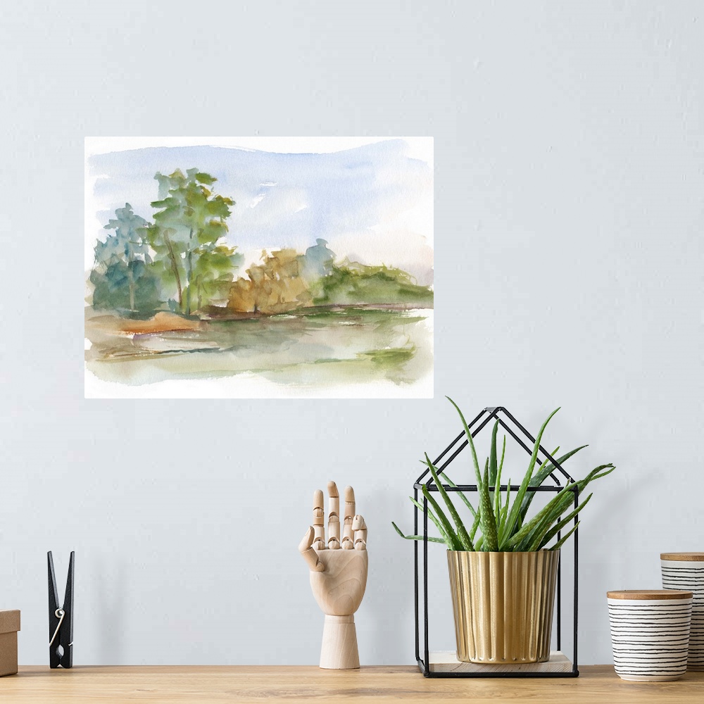 A bohemian room featuring Semi-abstract watercolor painting of a stream running through a green field.