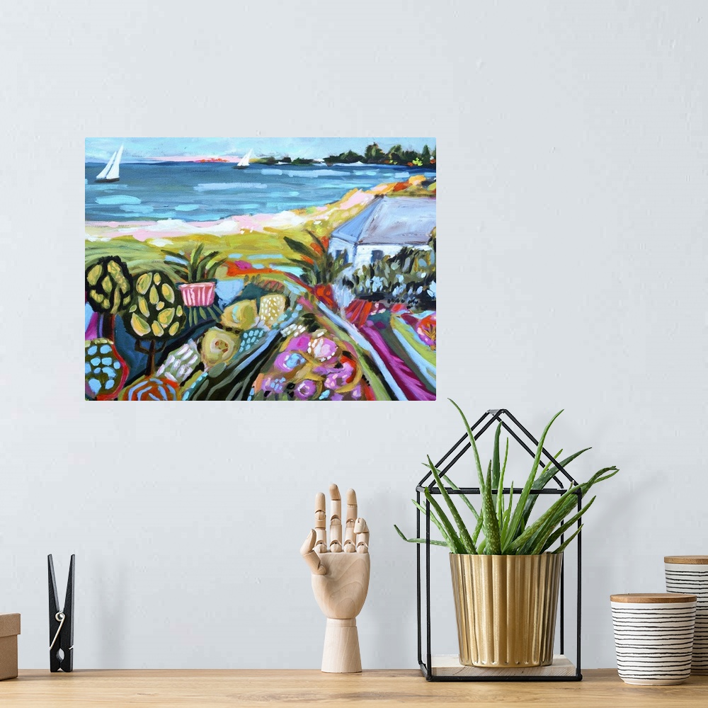 A bohemian room featuring Bohemian style illustration of a coastal landscape with flowering fields and sailboats on the water.