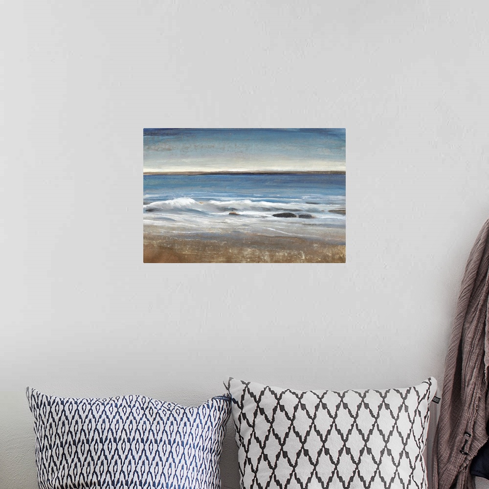 A bohemian room featuring Contemporary painting of a seascape with small waves.