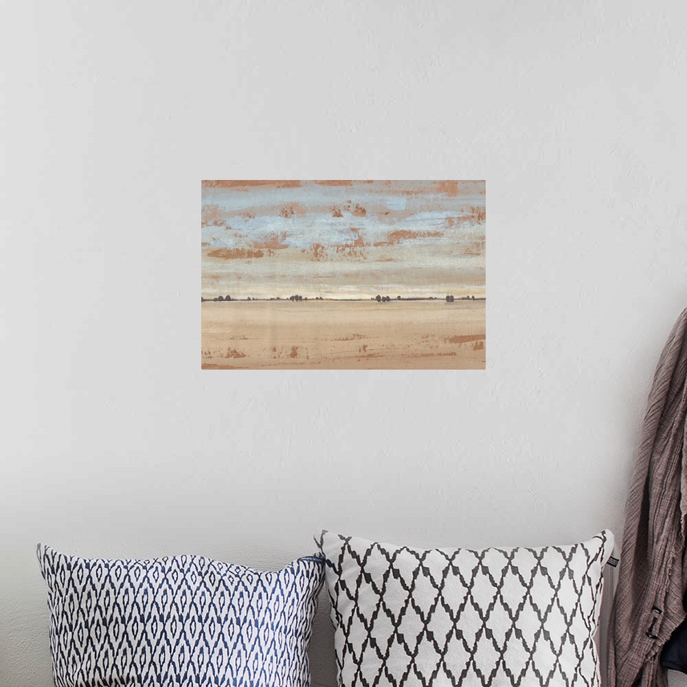 A bohemian room featuring Abstract landscape of an open desert under a pale sky.
