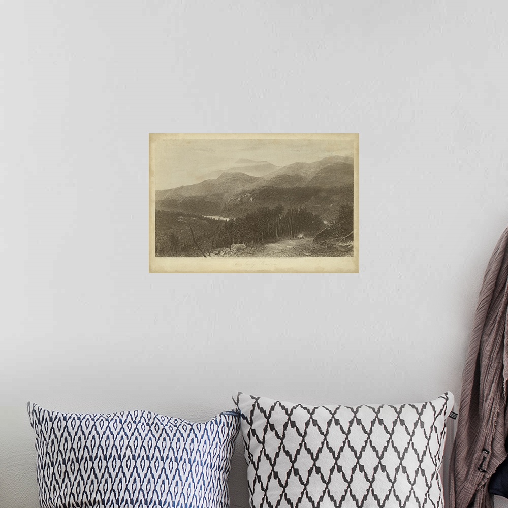 A bohemian room featuring Vintage artwork of the edge of a mountain range in sepia.