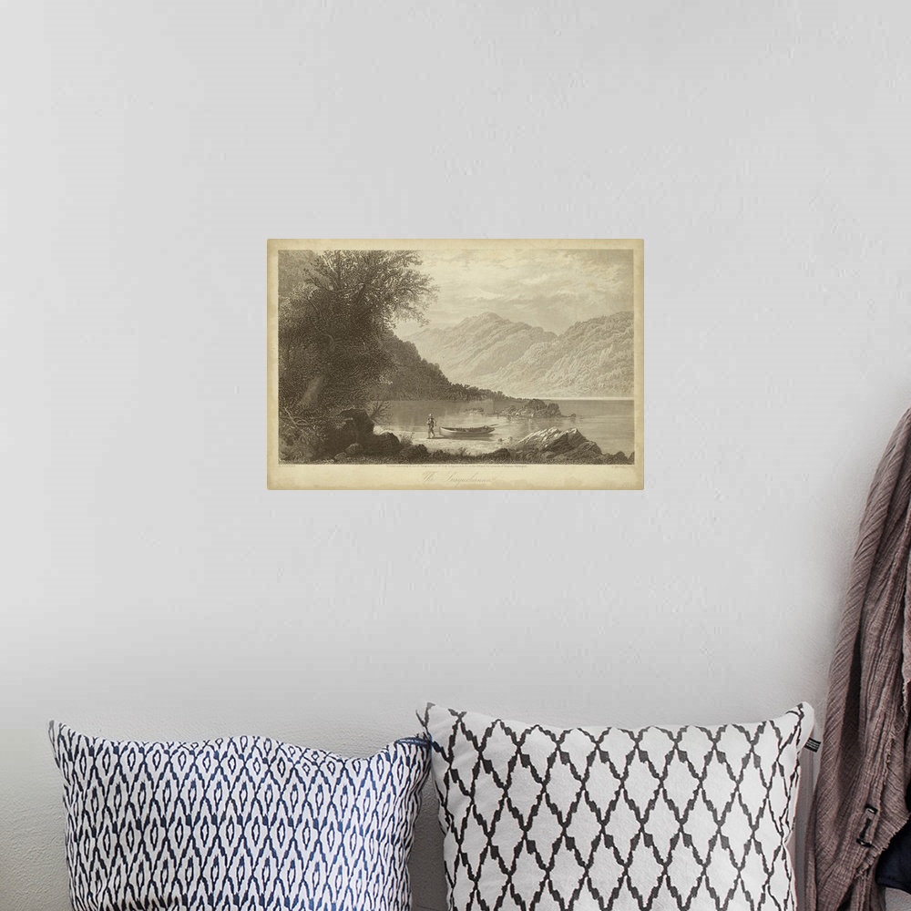 A bohemian room featuring Vintage artwork of a lake by the mountains in sepia.
