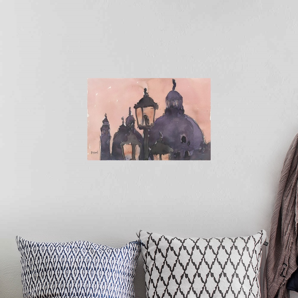 A bohemian room featuring Watercolor art print of lamp posts and the domes of buildings at sunset in Venice, Italy.