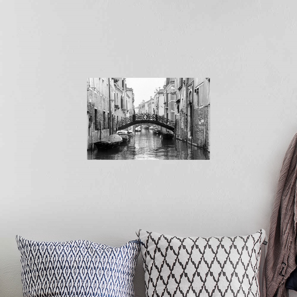 A bohemian room featuring Large photo on canvas of gondolas lining a canal in Venice.