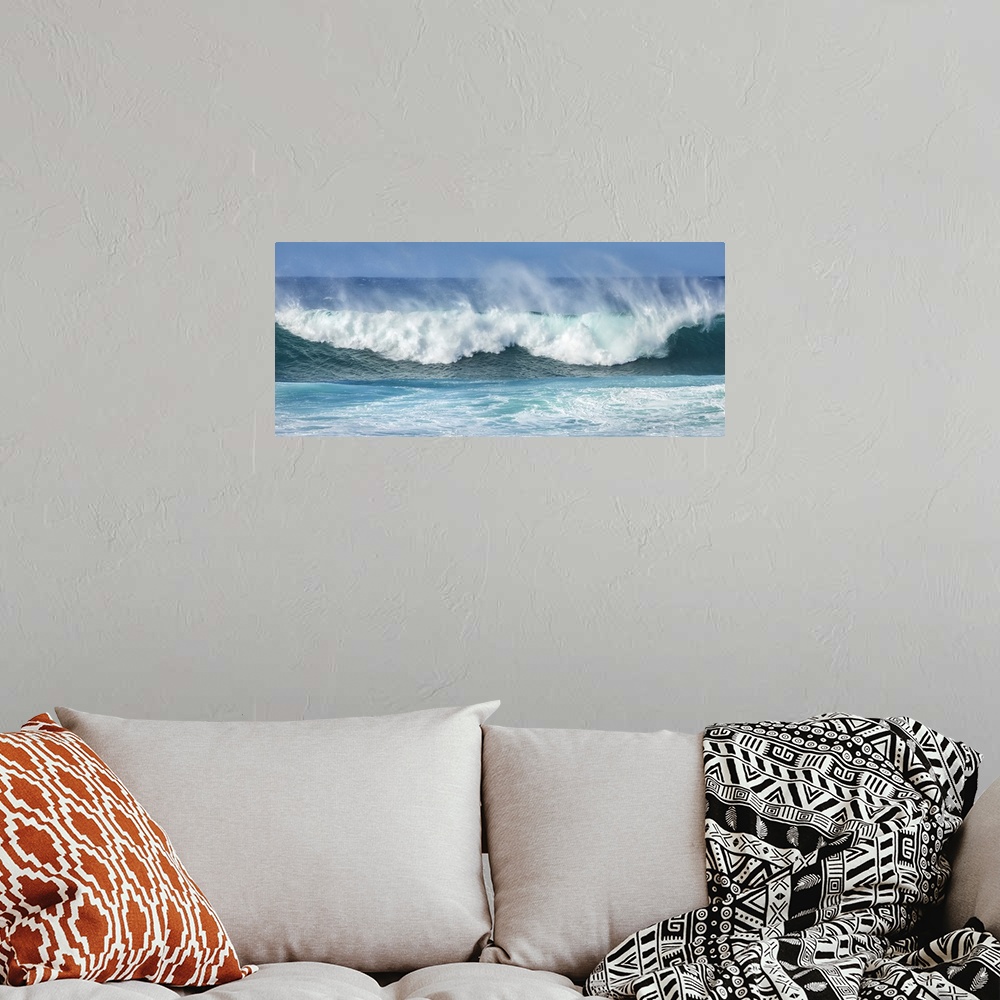 A bohemian room featuring Mist rising off crashing blue waves at the shore; Kihei, Maui, Hawaii, United States of America.