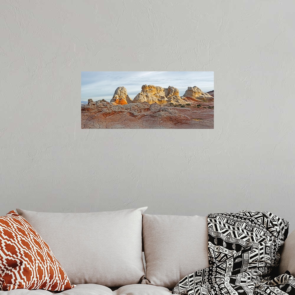 A bohemian room featuring Rugged rock formations in the early morning; White Pocket, Utah, United States of America