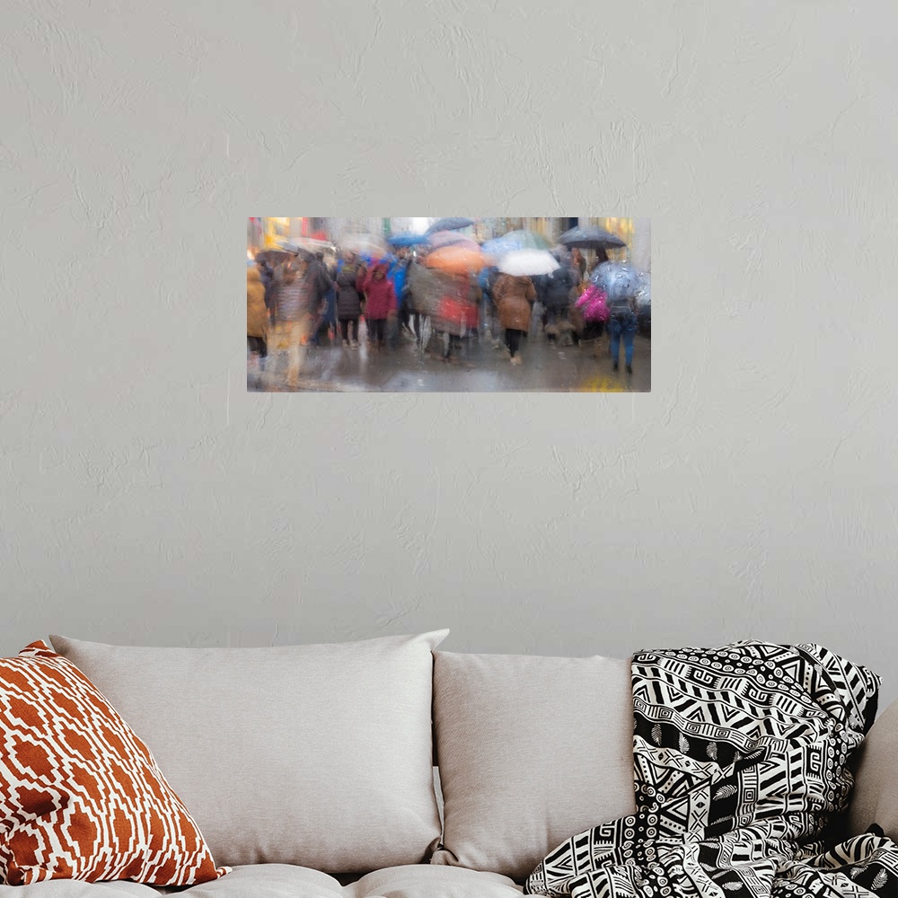 A bohemian room featuring A contemporary slow shutter speed photograph of people walking with umbrellas in the rain