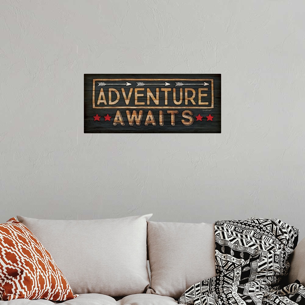 A bohemian room featuring Adventure Awaits