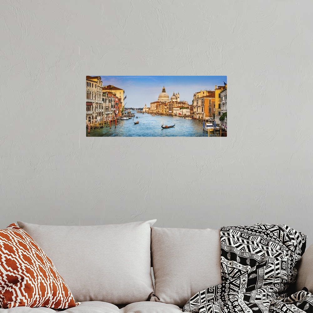 A bohemian room featuring Panoramic view of famous canal grande and Basilica Di Santa Maria Della salute in golden evening ...