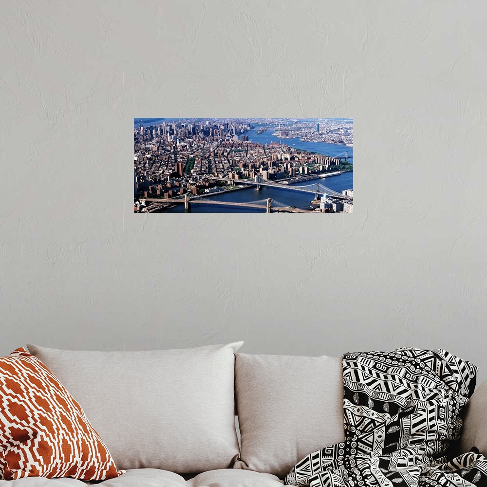 A bohemian room featuring Aerial panorama of suspension bridges and bustling New York City metropolis.