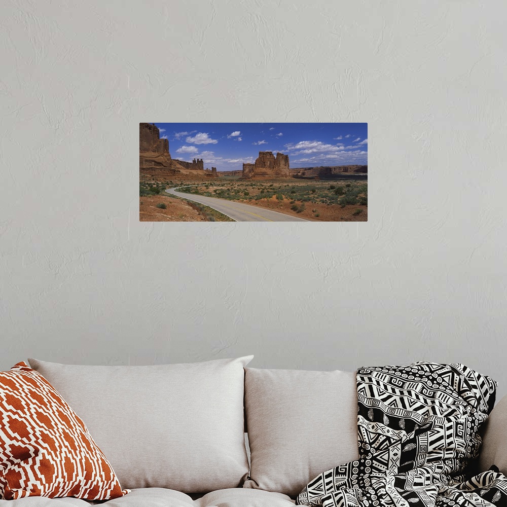 A bohemian room featuring Empty road running through a national park, Arches National Park, Utah