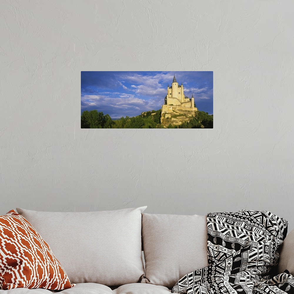 A bohemian room featuring Low angle view of a castle on a hill, The Alcazar Castle, Alcazar, Segovia, Castilla y Leon, Spain
