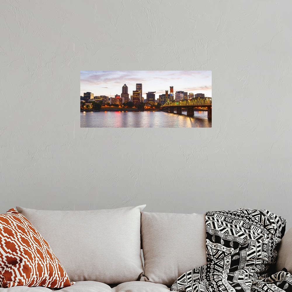 A bohemian room featuring Panoramic photograph of the Portland, Oregon skyline lit up with yellow lights at the beginning o...