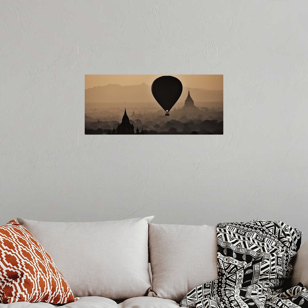 A bohemian room featuring Hot air balloons floating above the temples of Bagan, Myanmar at sunrise