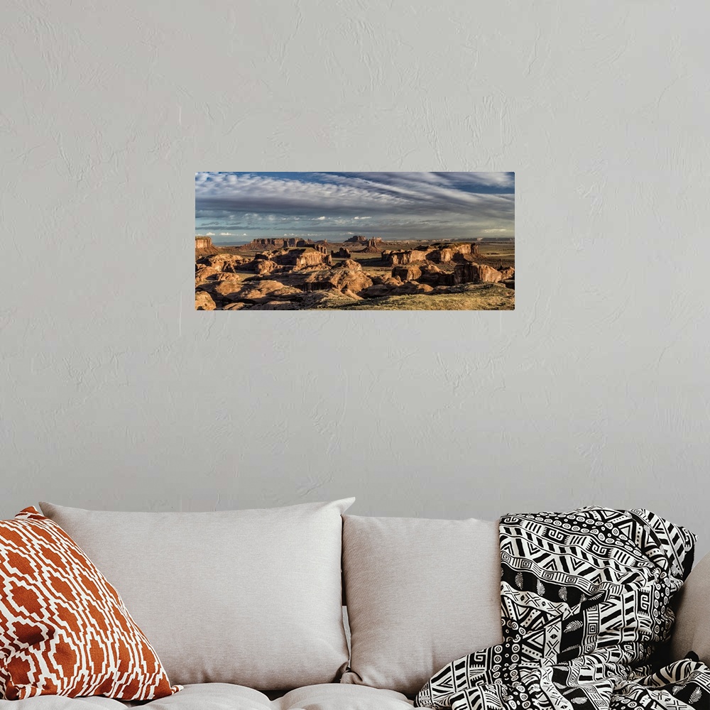 A bohemian room featuring Panorama of Hunts Mesa rock formation in Monument Valley, Arizona