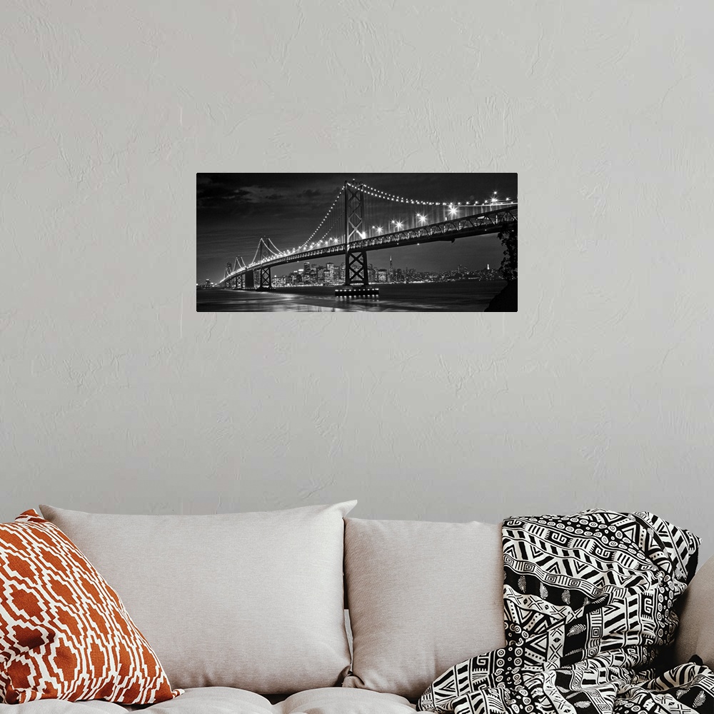 A bohemian room featuring The Oakland Bay Bridge after dark