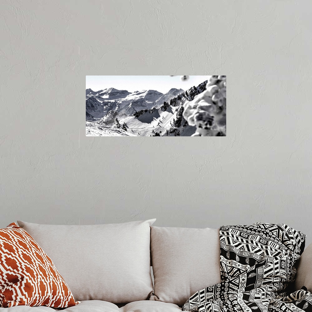 A bohemian room featuring Black and white landscape photograph of the Wasatch Range in Utah with a skier hiking up in the m...