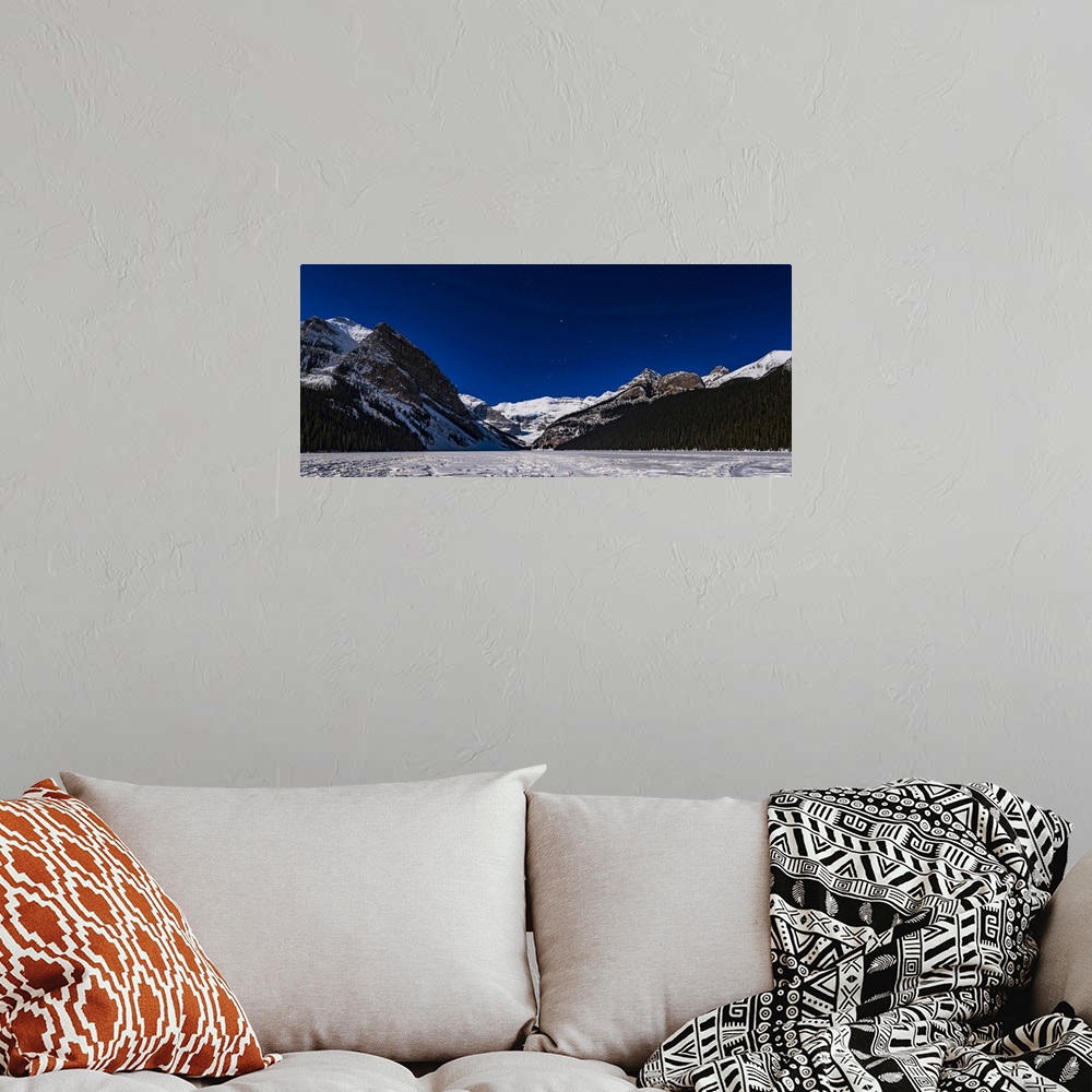 A bohemian room featuring Orion setting over the iconic Victoria Glacier at Lake Louise, frozen here in March, and with the...