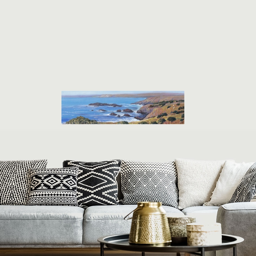 A bohemian room featuring Painted panoramic landscape of a rocky cliff ocean coast.