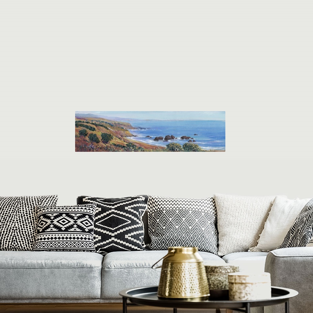 A bohemian room featuring Painted panoramic landscape of a rocky cliff ocean coast.