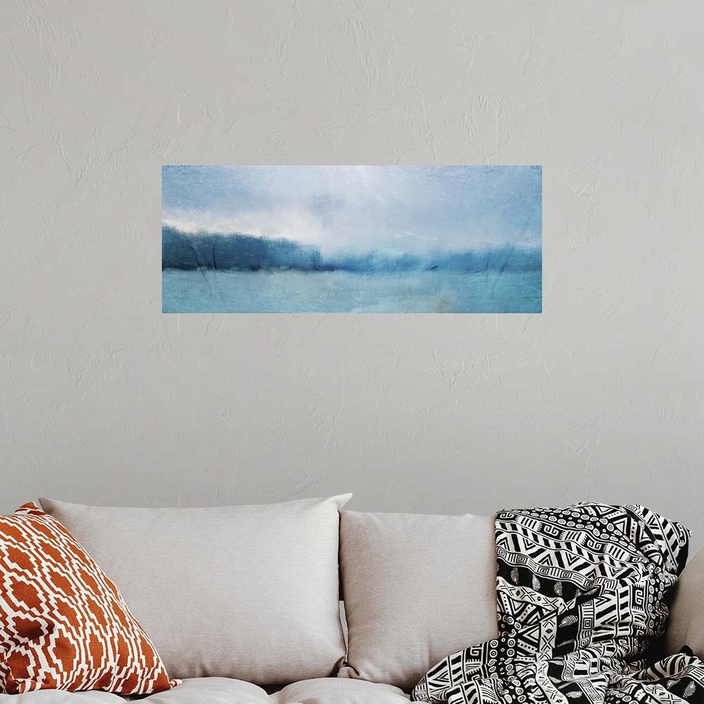 A bohemian room featuring Abstract landscape painting of a deep blue lake with forests along the edge.