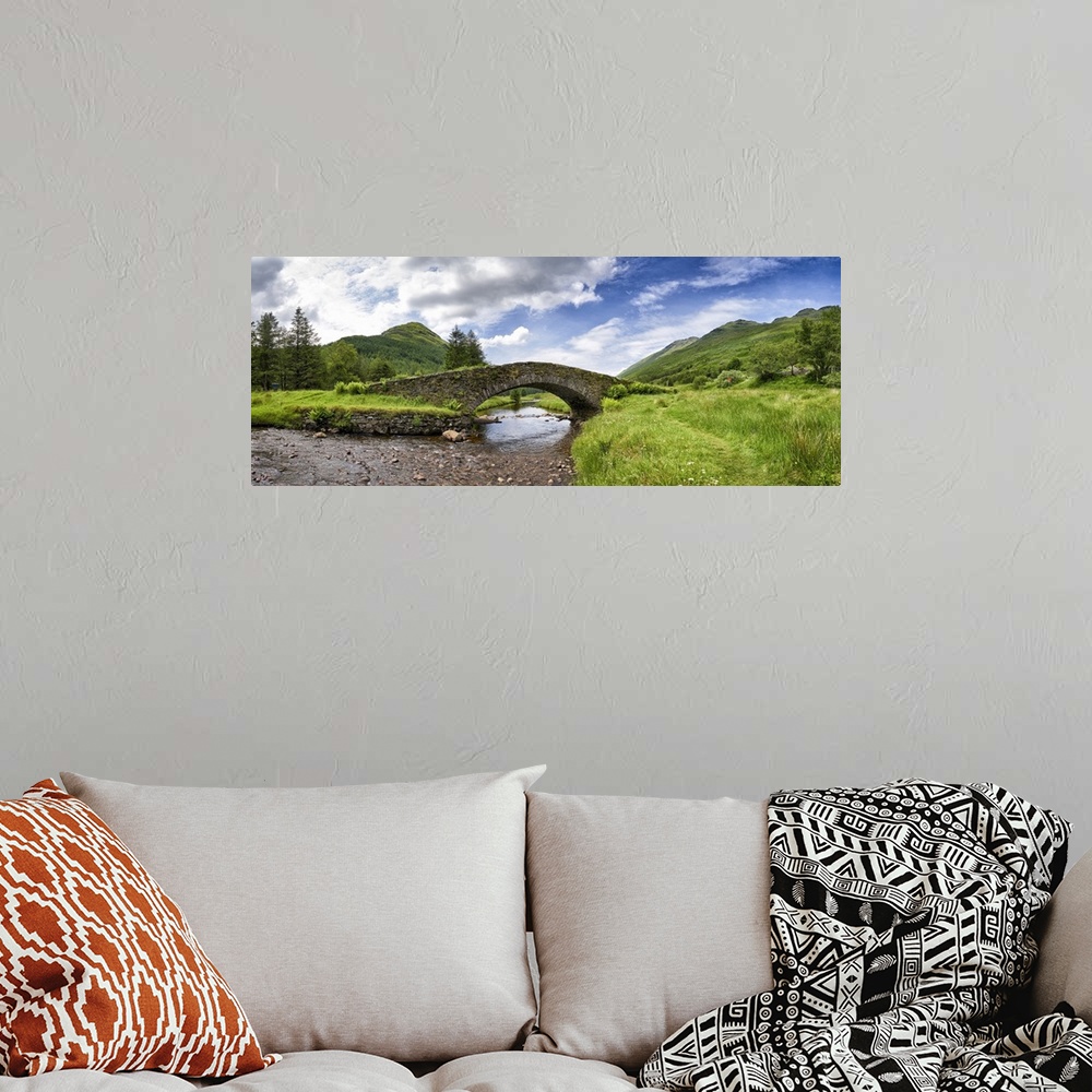 A bohemian room featuring Panoramic view of Butter Bridge over Kinglas Water in the Loch Lomond National Park in Scotland.