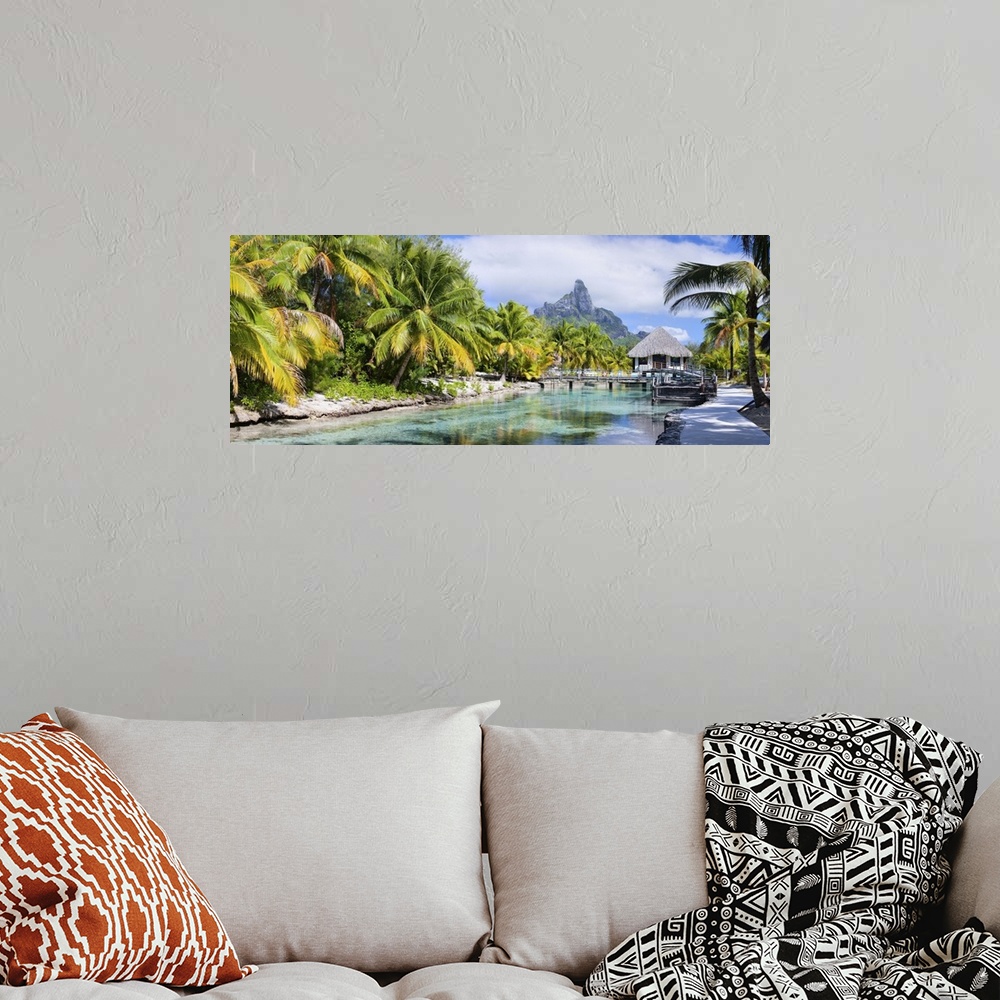 A bohemian room featuring Panorama of a beautiful coast with Otemanu mountain view on Bora Bora island.
