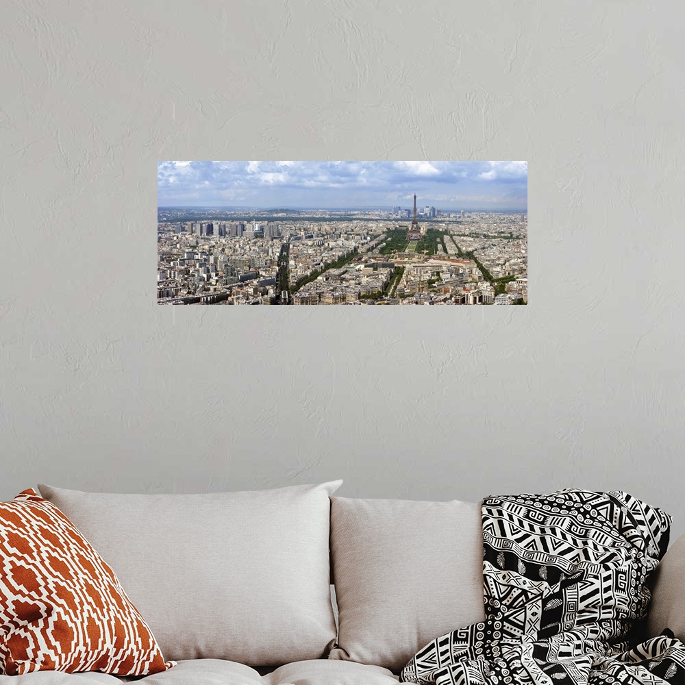 A bohemian room featuring Paris aerial panoramic view from Montparnasse tower over Champs de Mars and Eiffel tower.