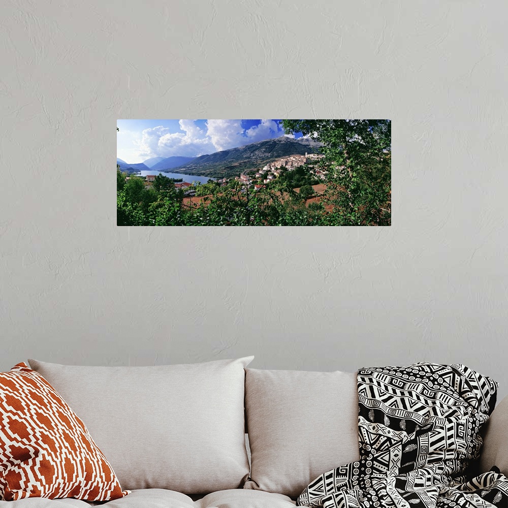 A bohemian room featuring Italy, Abruzzo, Abruzzi, Abruzzo National Park, Barrea, View of town and lake