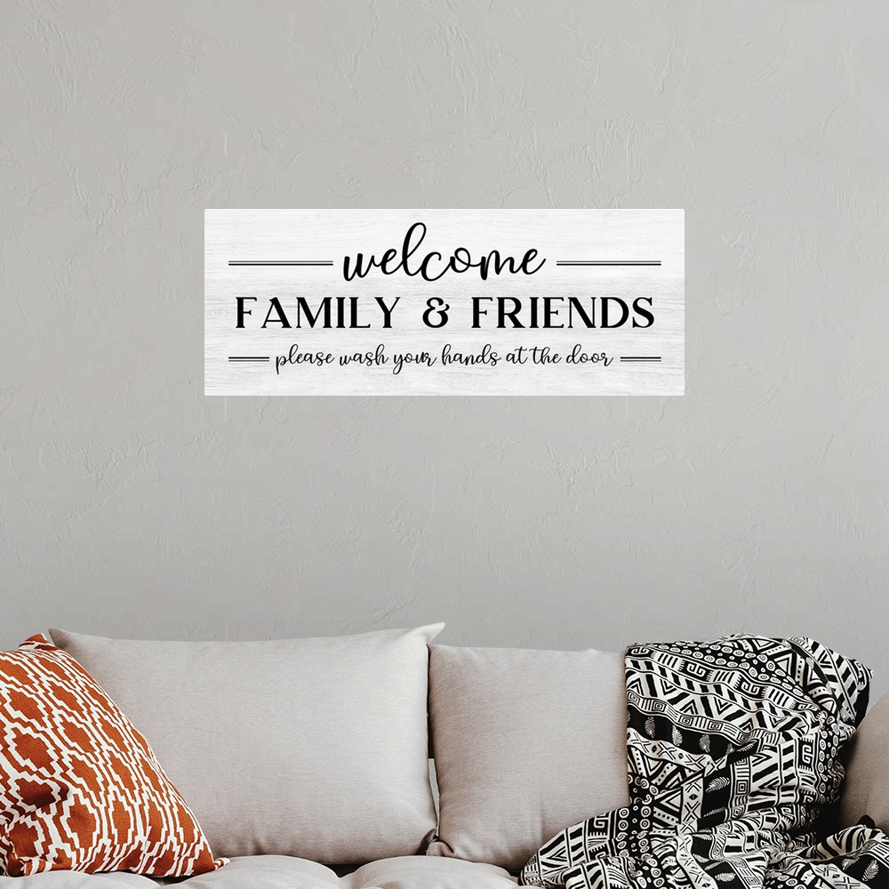 A bohemian room featuring Welcome Family & Friends