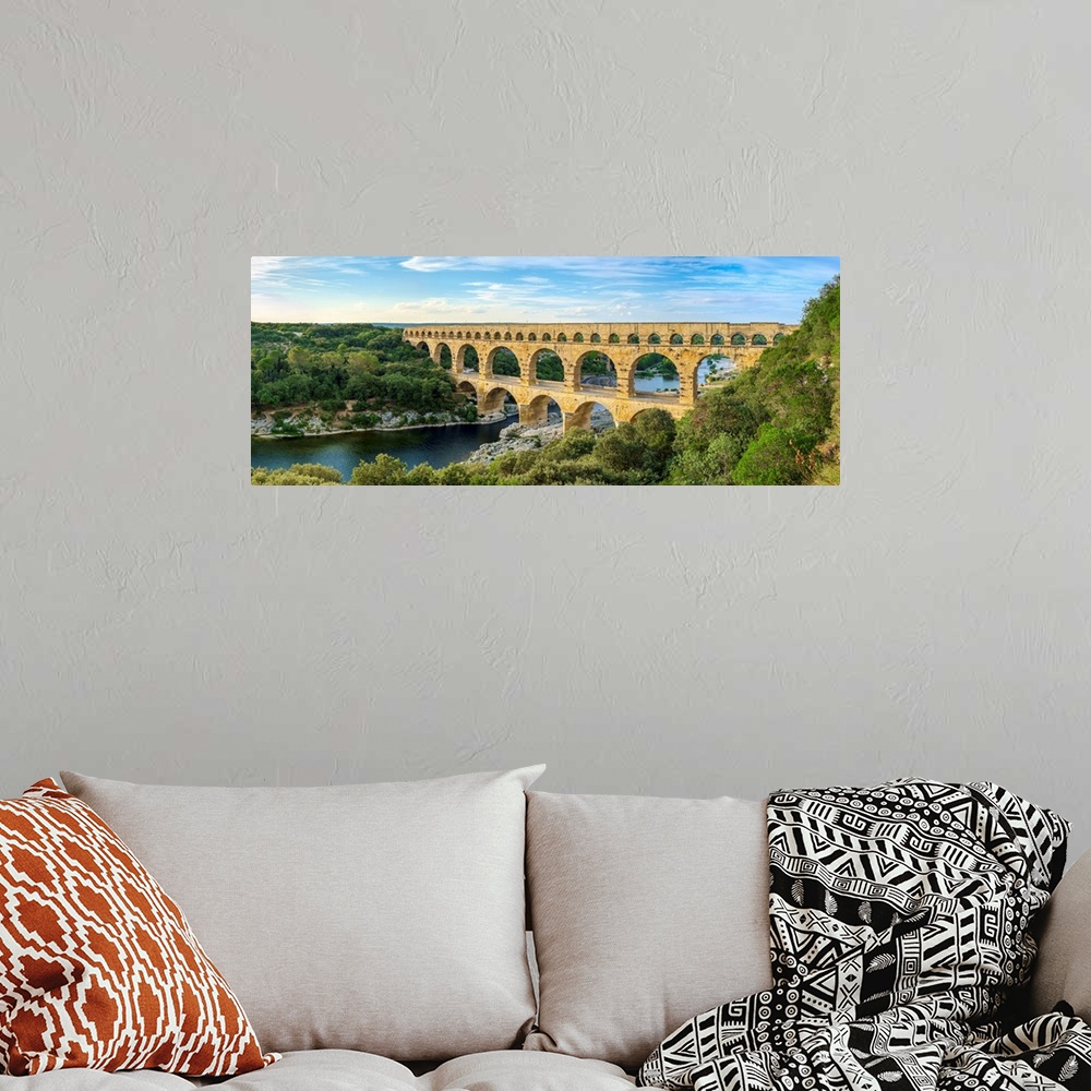 A bohemian room featuring Pont du Gard Roman aqueduct over Gard River in late afternoon, Gard Department, Languedoc-Roussil...
