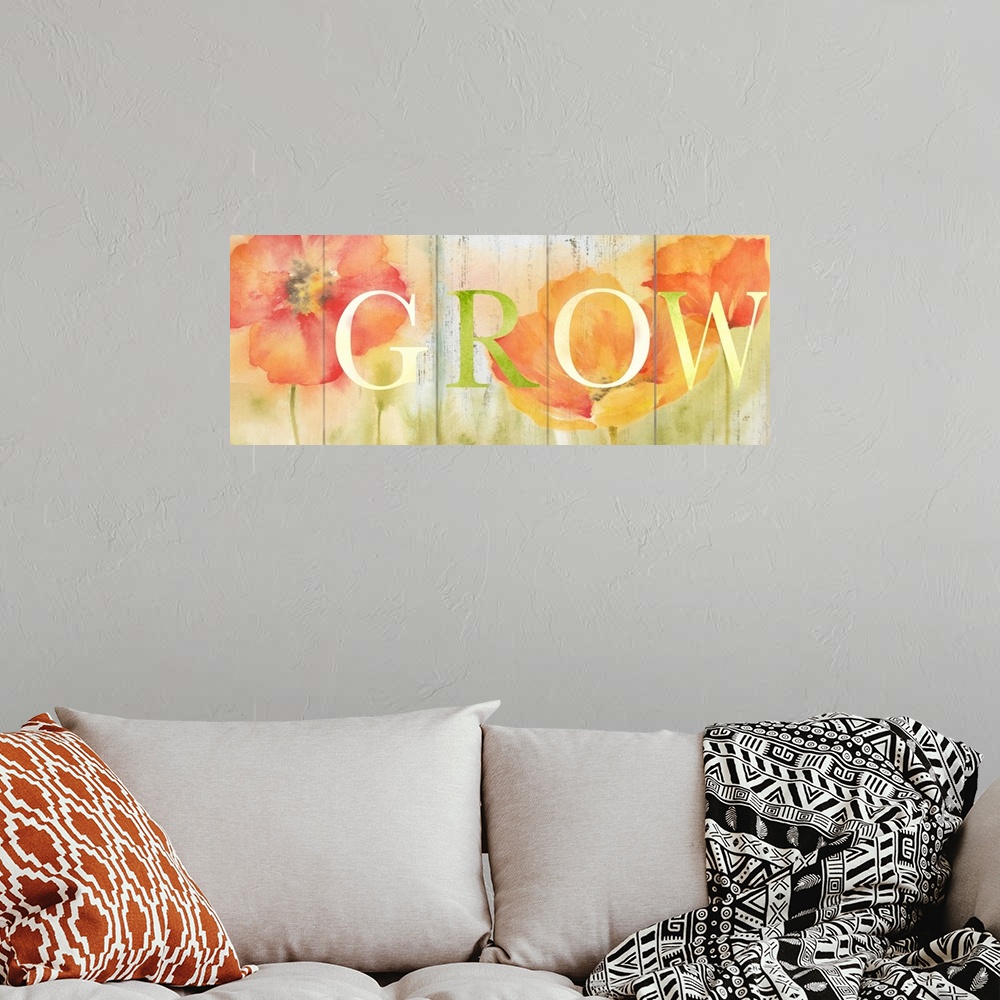 A bohemian room featuring "Grow" in white and green over a watercolor image of orange and red flowers with a wood plank app...