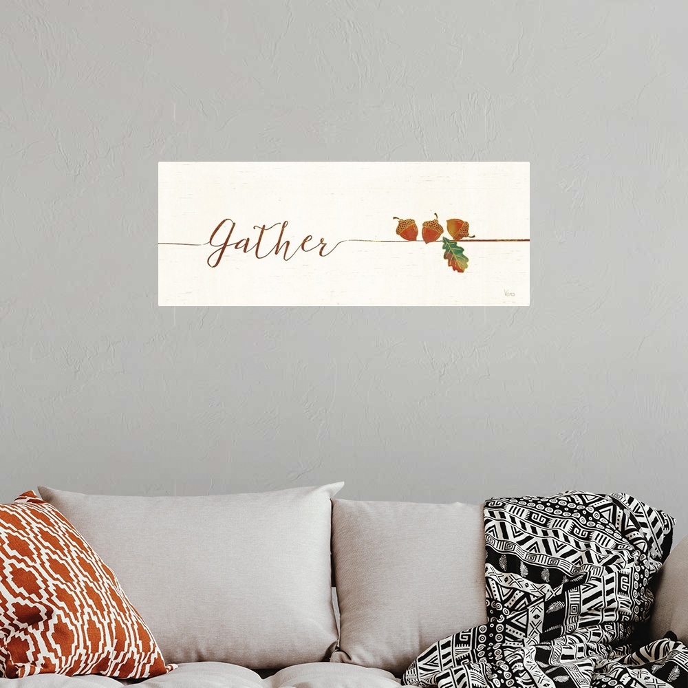A bohemian room featuring Horizontal artwork of "Gather" in handwritten text with a a few acrons.
