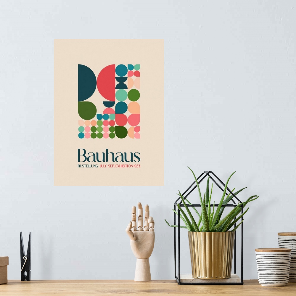 A bohemian room featuring A mid-century style poster advertising Bauhaus