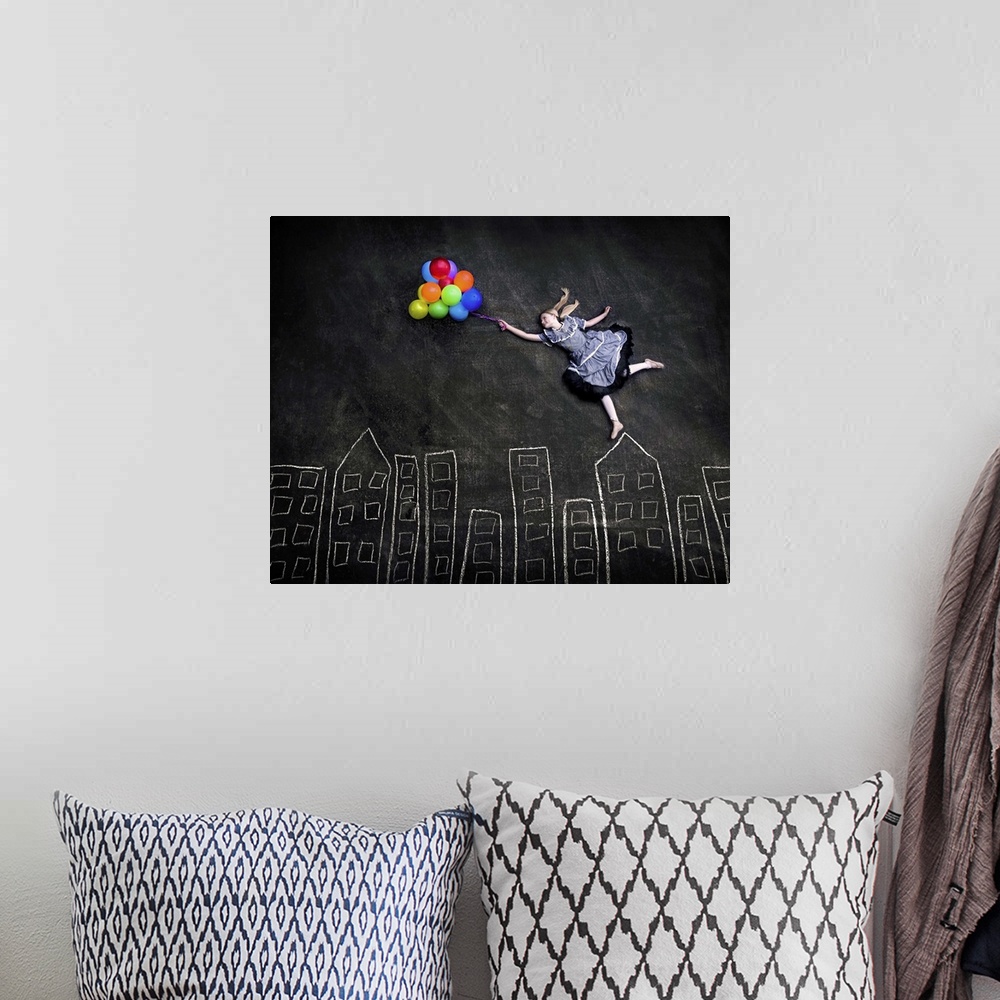 A bohemian room featuring Conceptual image of a girl holding a bunch of colorful balloons appearing to float over a simple ...