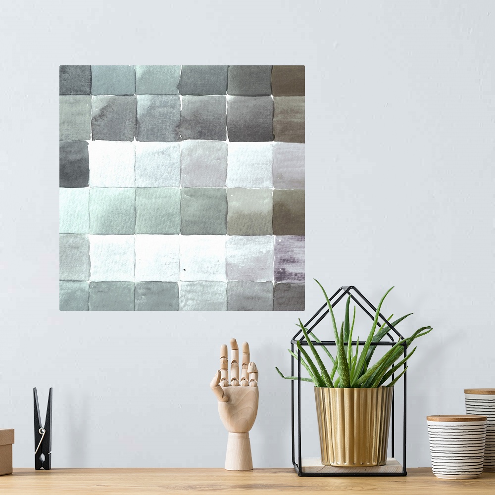 A bohemian room featuring Contemporary artwork of square tiles in various cool tones.